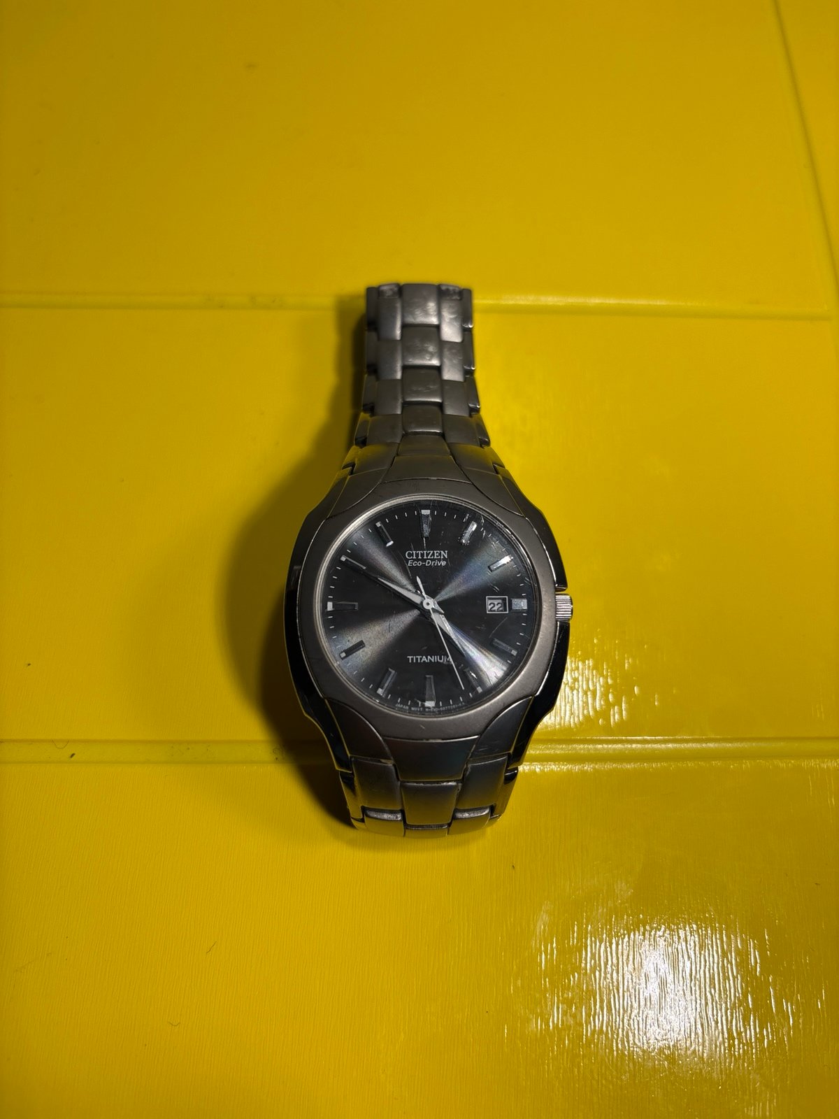 Citizen eco-drive titanium band and black and silver face, lightly used