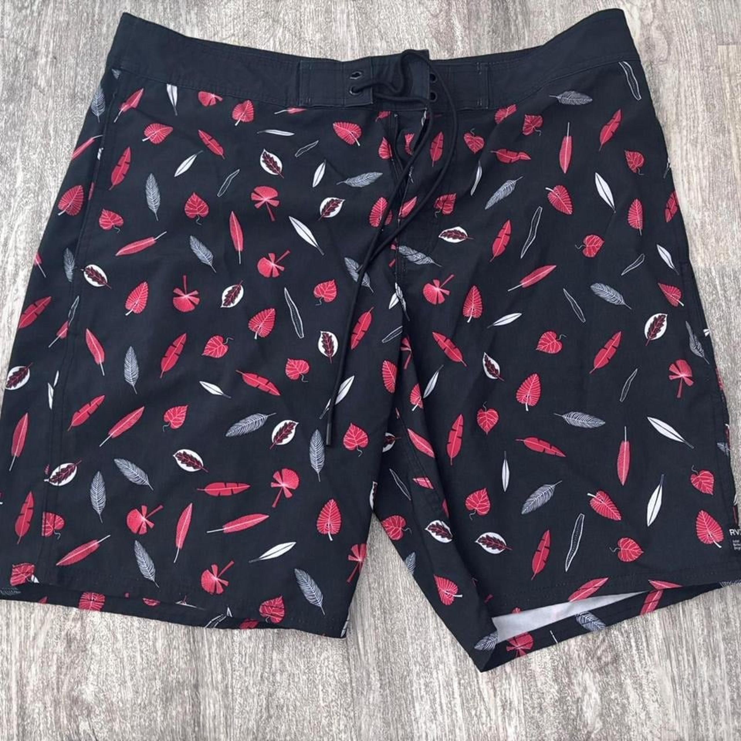 RVCA black and red leaf board shorts. Men size 34