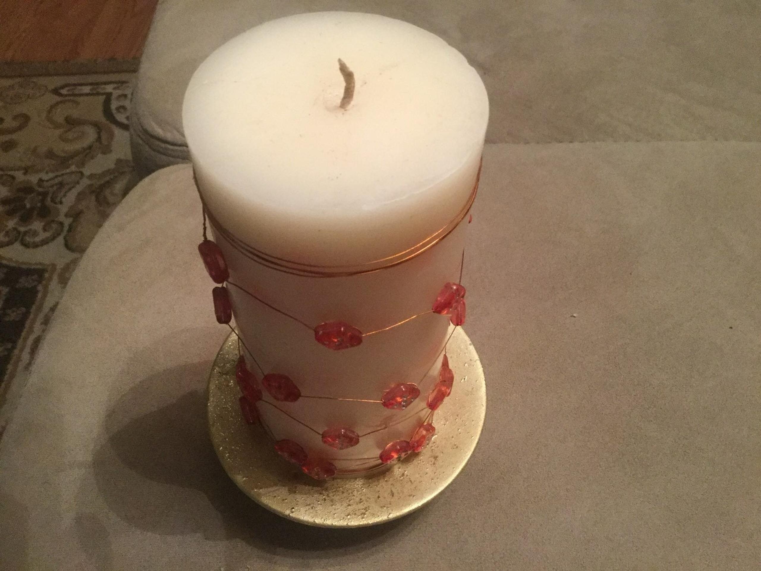 Candle With Red Wired Dice