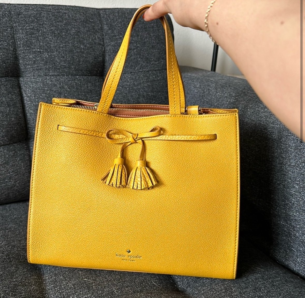 Mustard colored leather Kate spade purse with crossbody strap