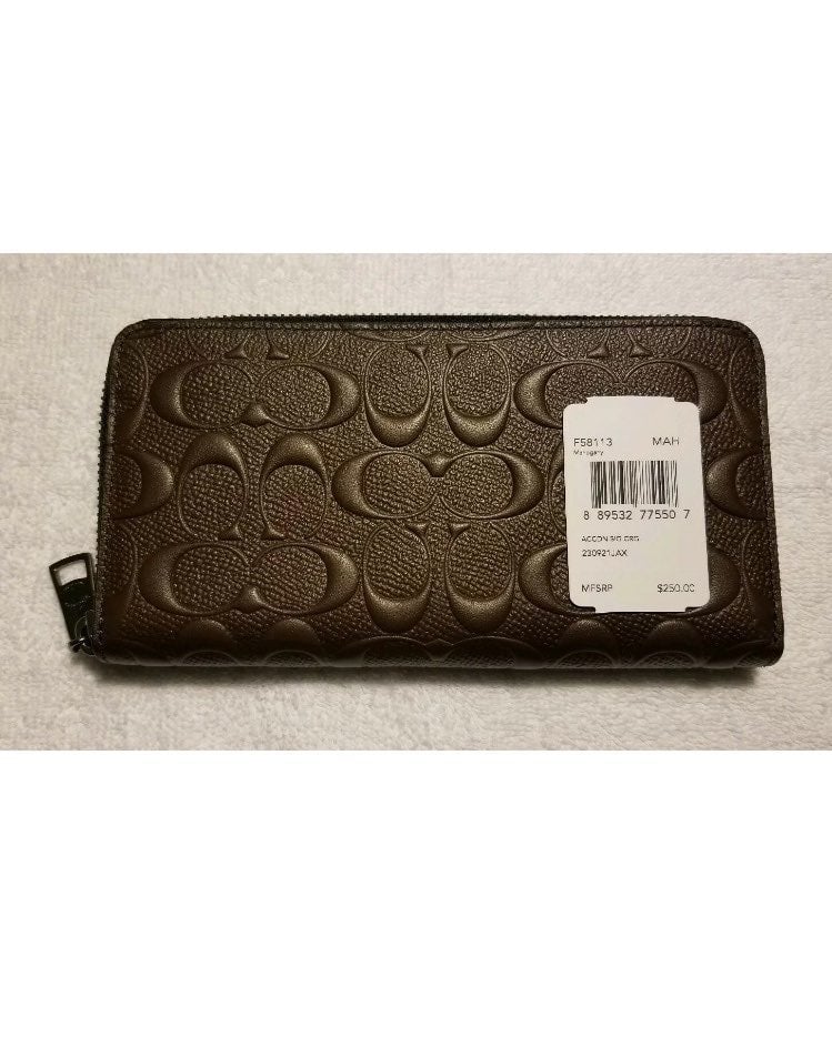 Like New Coach Embossed “C’s” Mahogany Leather Zip Up Wallet