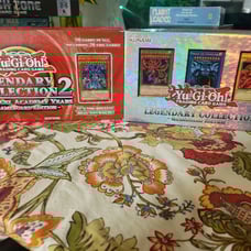 Two sets of yu gi oh game boards