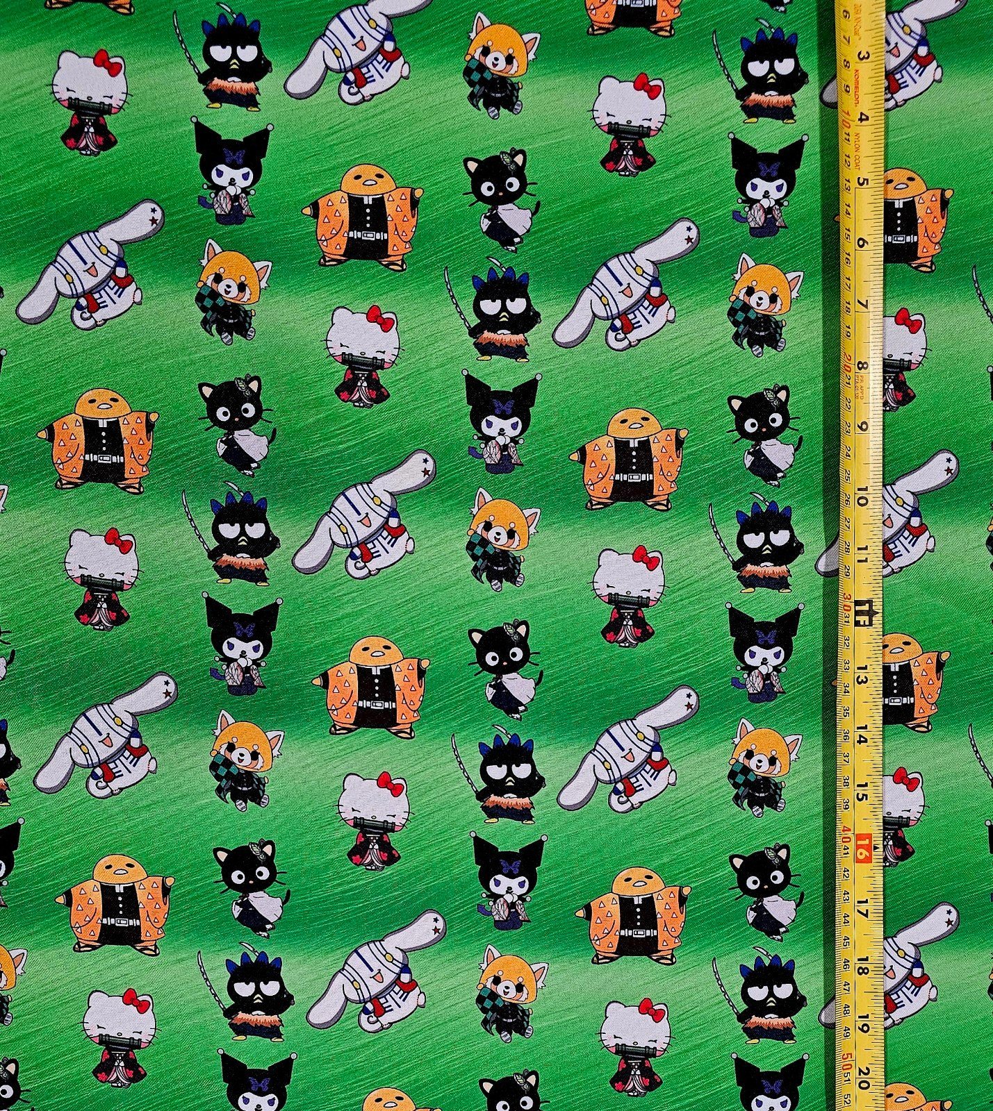 DEMON SLAYER X HELLO KITTY FRIENDS MASHUP GREEN 1 YARD FABRIC