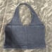 blue halter top with a deep V neckline and straps. Made from 100% cotton.