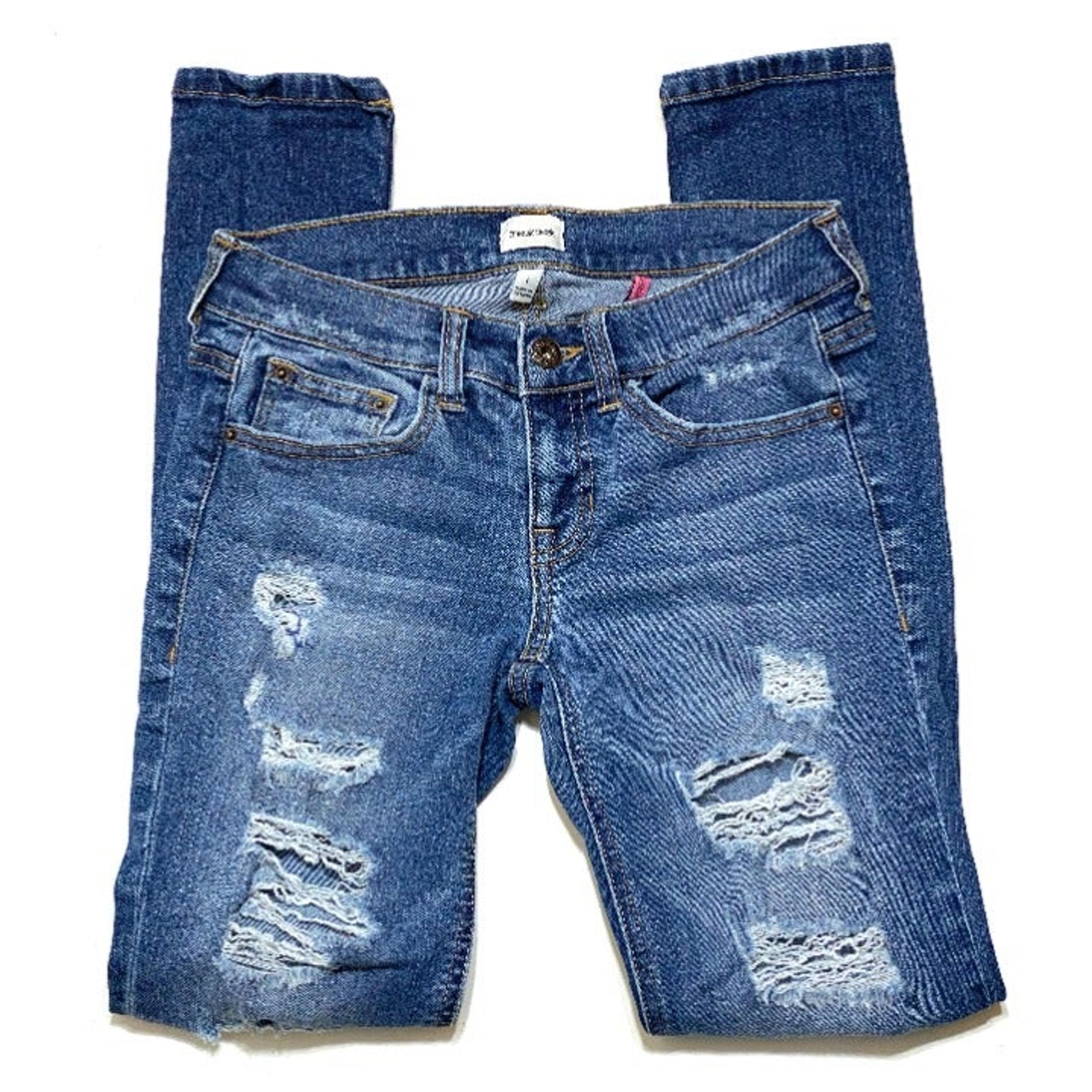 Sneak Peek Distressed Skinny Jeans