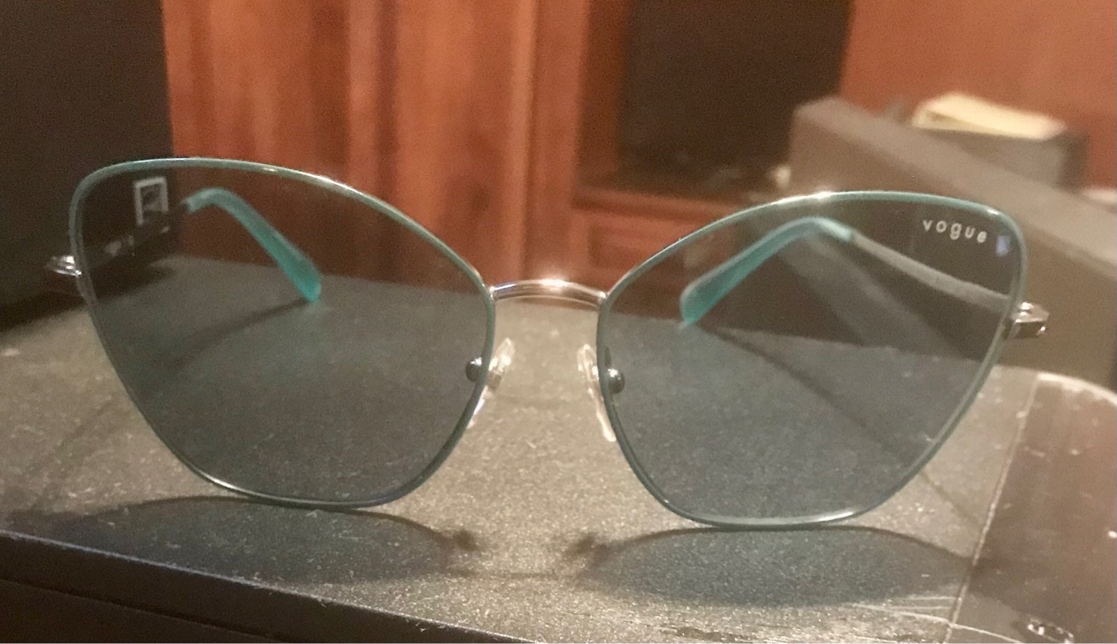 Women’s Vogue Sunglases, with case, blue tinted.