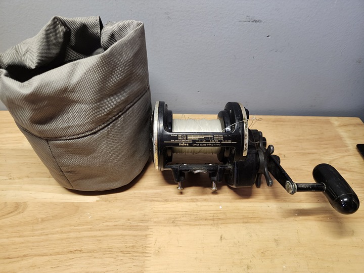 Daiwa SL50SH One Cast Fishing Spinning Reel MADE IN JAPAN Black with cover