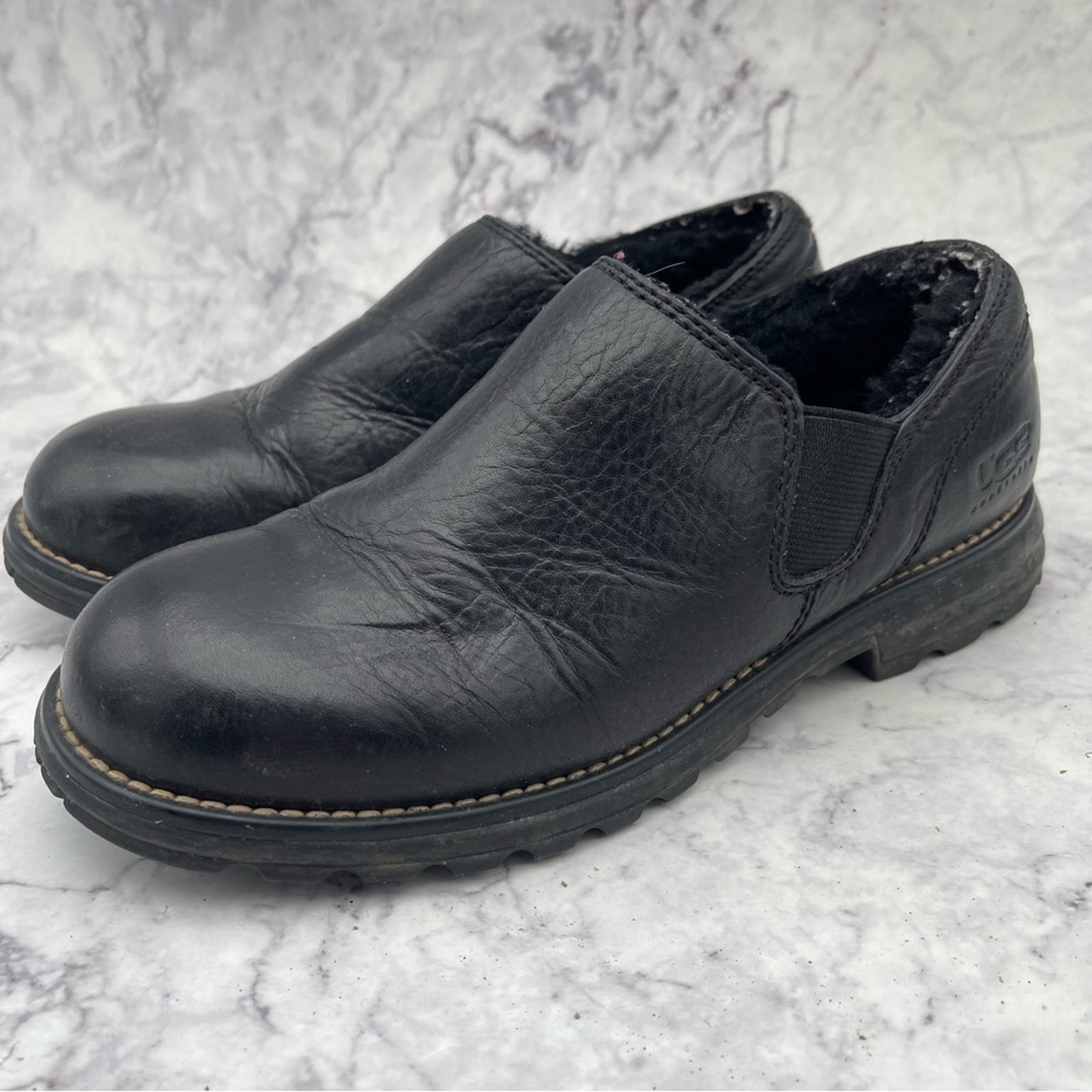 UGG, Black Leather Slip On Shoes. Size 7. In excellent condition!