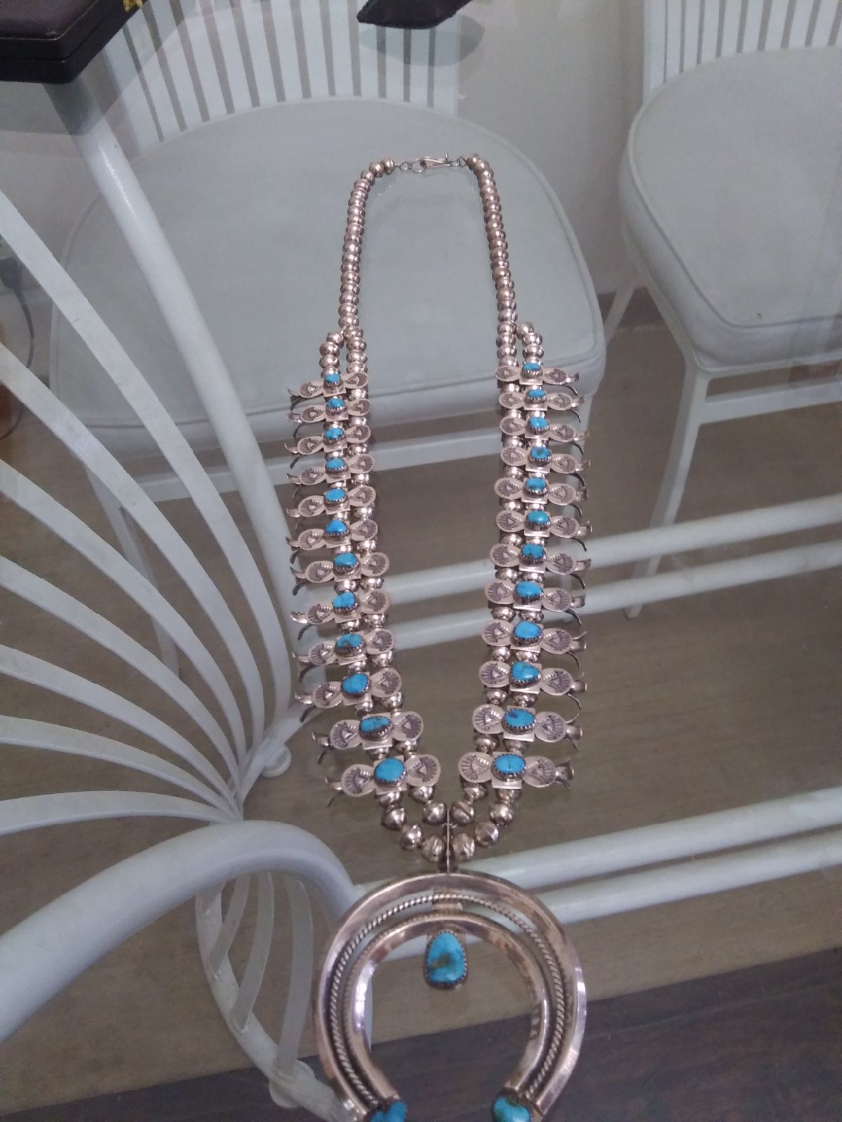 It's a signed sterling and turquoise ma