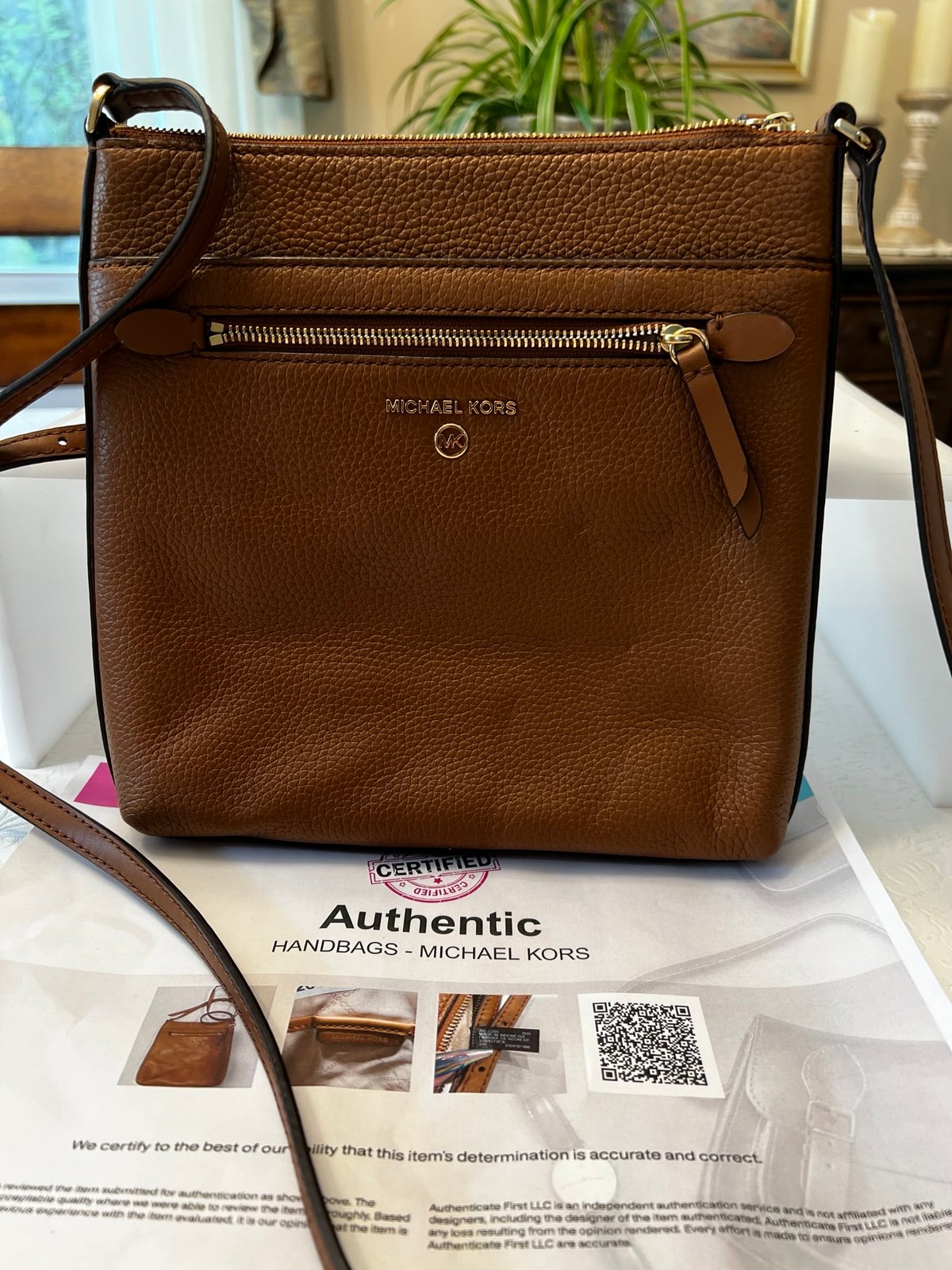 Michael Kors Crossbody purse measures 9 x 9 1/2“