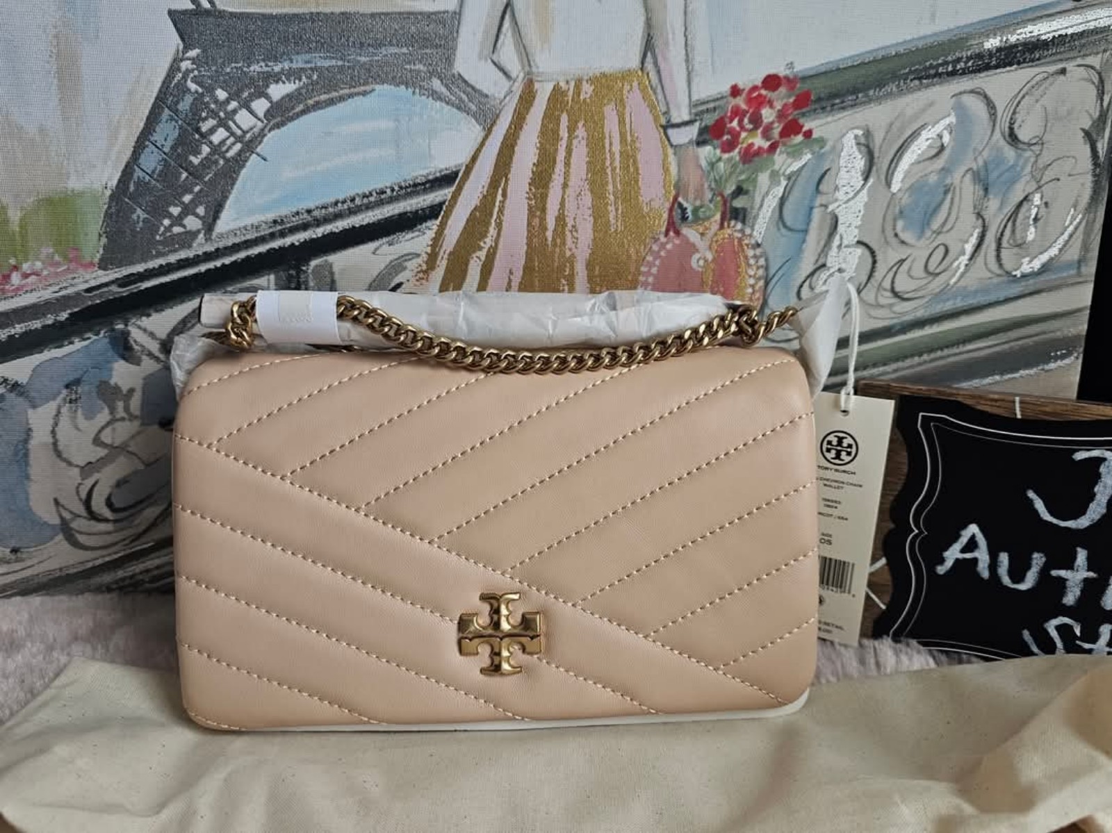 TORY BURCH KIRA CHEVRON CHAIN WALLET in Apricot color.
