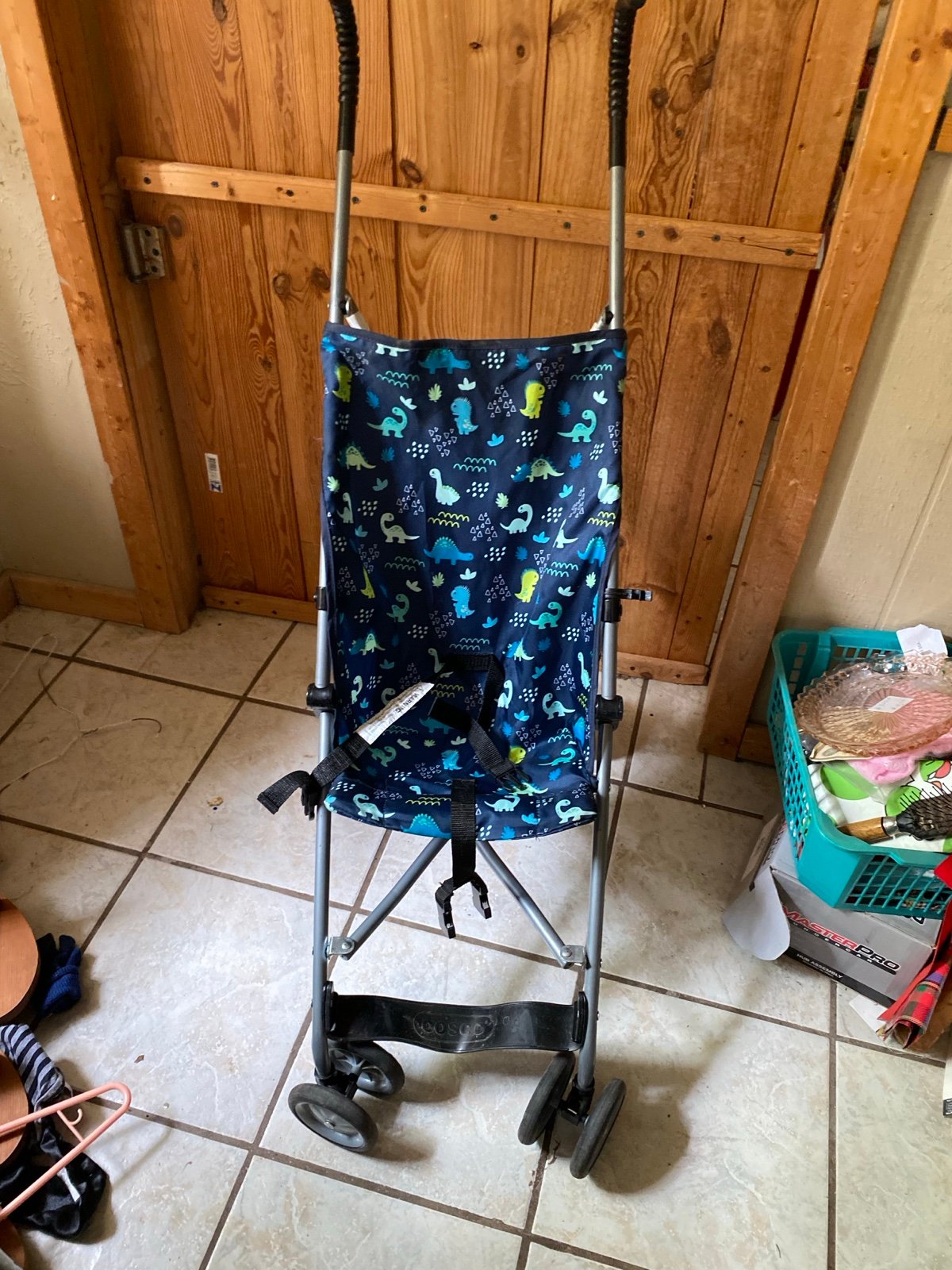 Navy blue stroller with dinosaur print