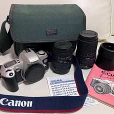 Canon EOS Kiss film camera with two Sigma lenses and lens hoods.