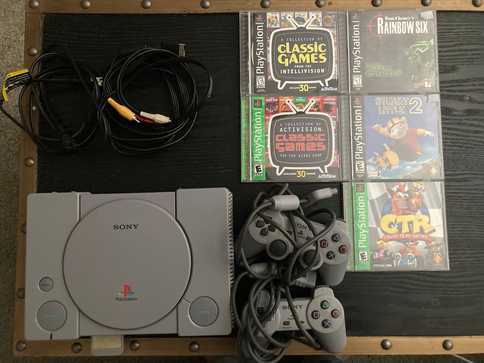 PlayStation Console with Controllers and Games