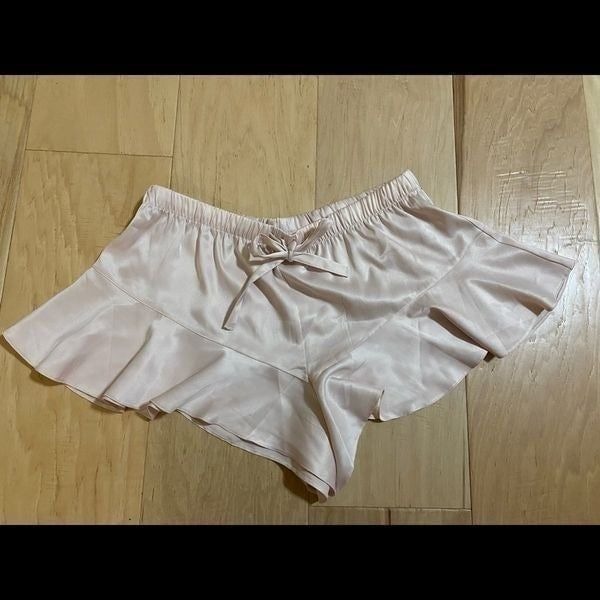 Victoria’s Secret NWOT light pink satin ruffle sleep shorts in size small.