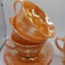 Set of 3 fire king peach lustre tea cups and saucers