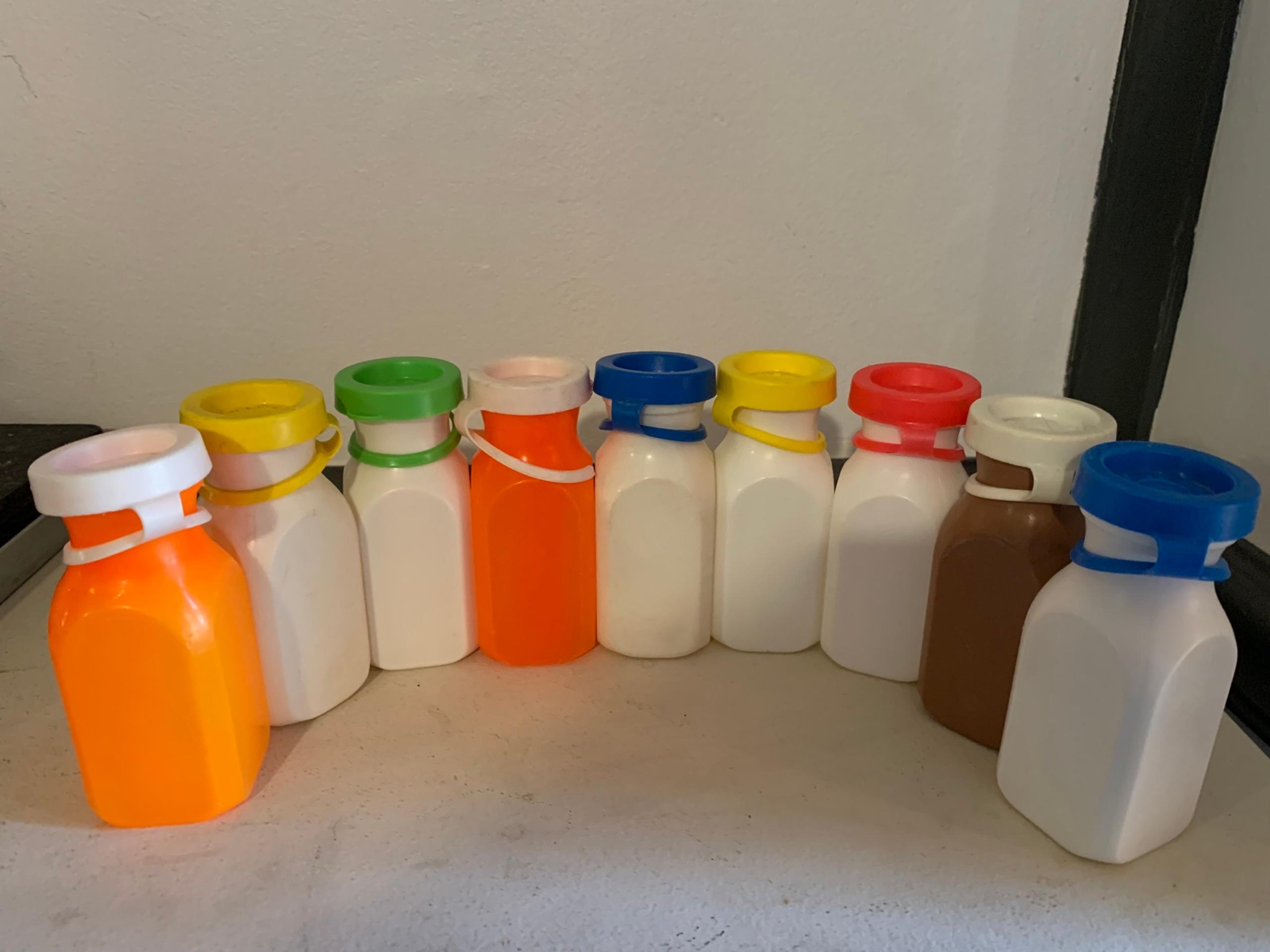 9 Vintage Fisher Price Toys Milk Juice Bottles White Yellow Orange Brown