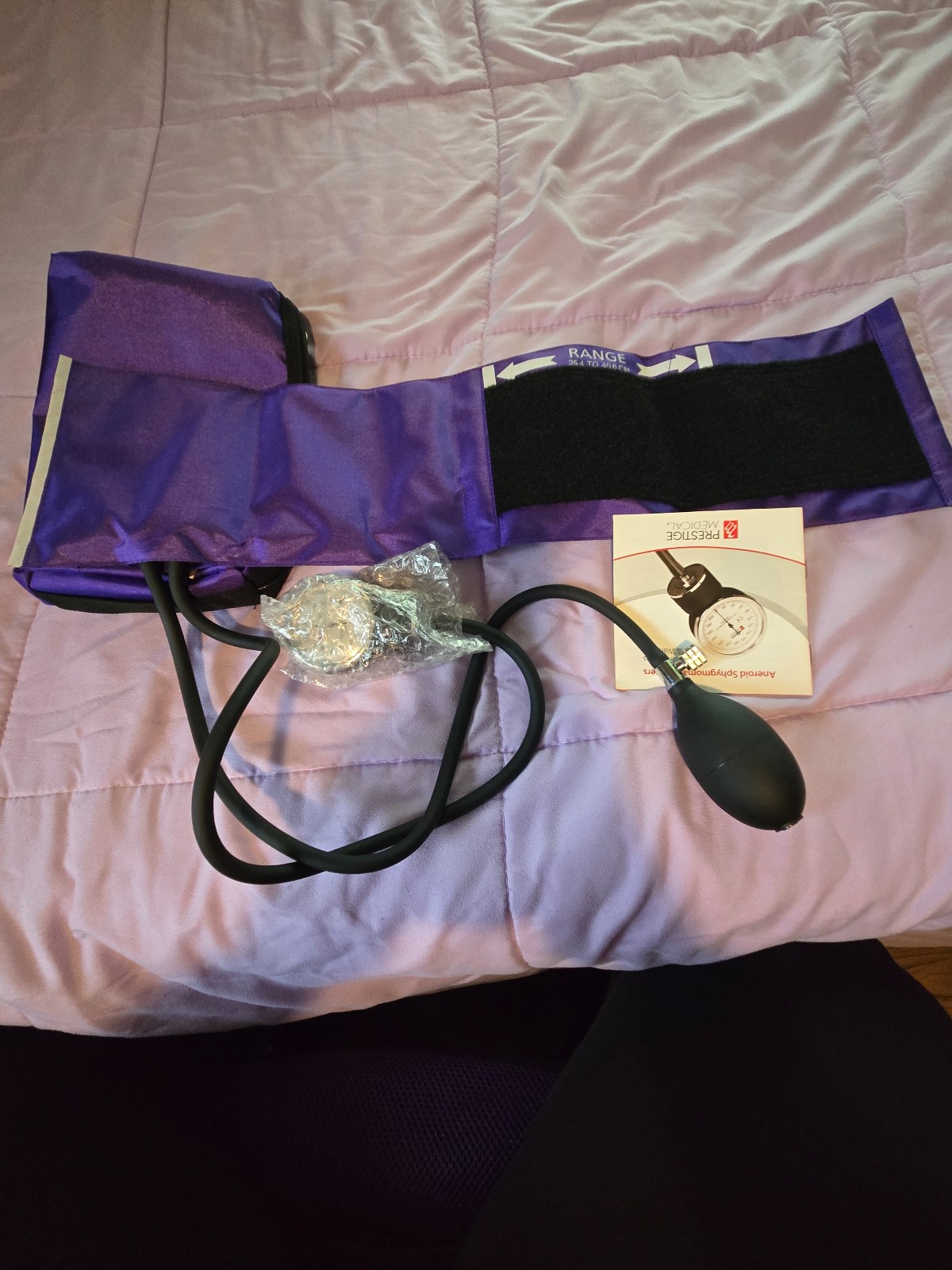 Adult blood pressure cuff in purple, never used