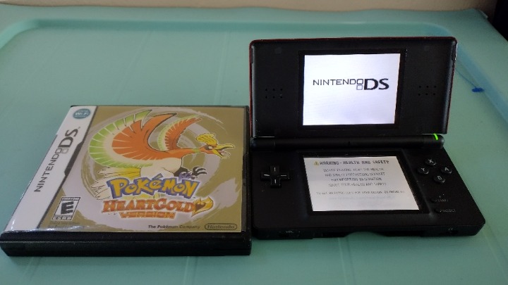 Nintendo DS Lite in red with accessories