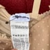Intimissimi - nude bustier top with a bow at the center of the chest. Tagged a w