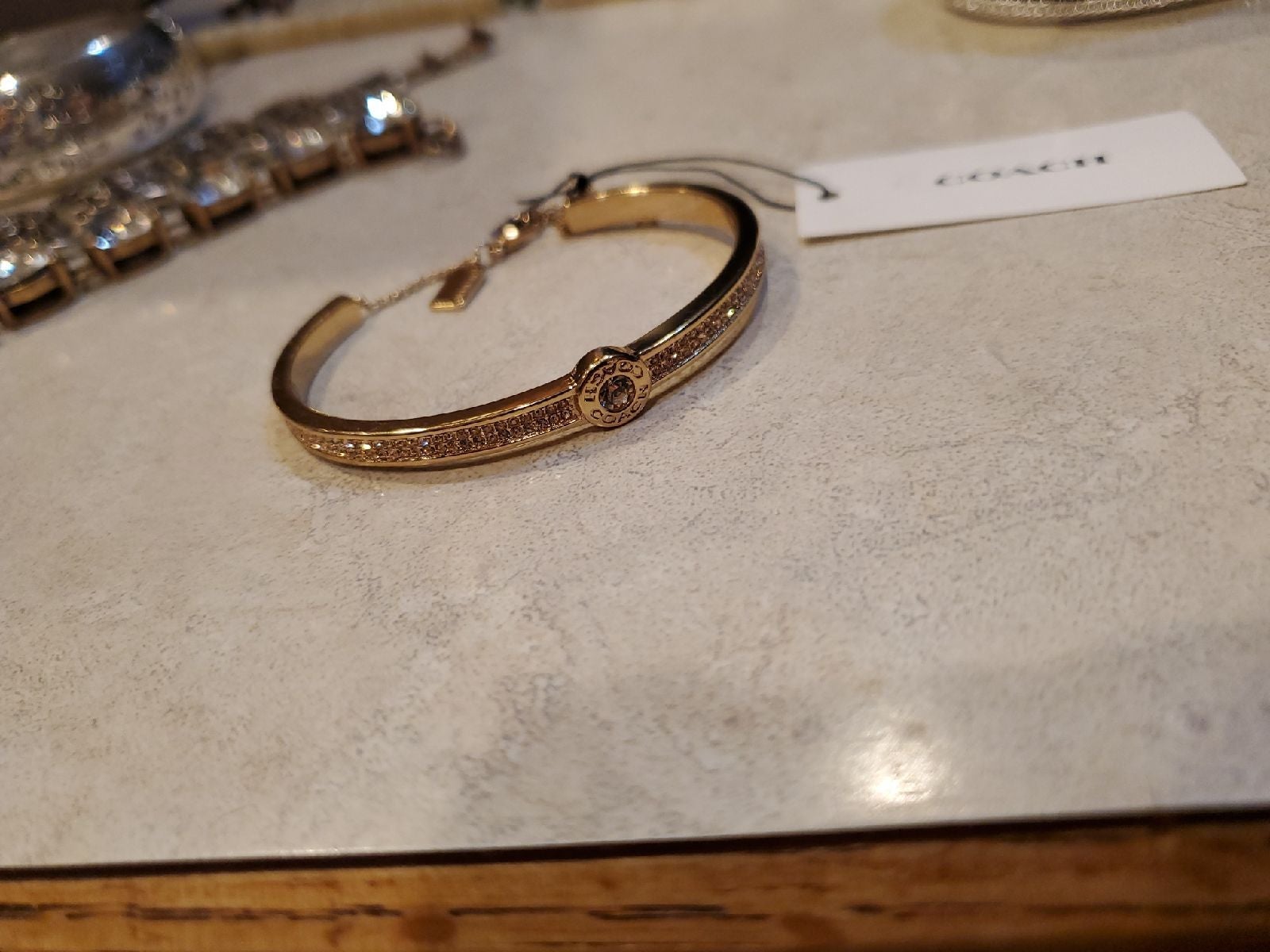 Coach Golden Rhinestone Bracelet. Beautiful piece. New with tags. Retails for 13