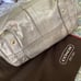Authentic Coach gold satchel handbag.