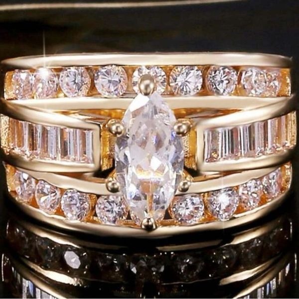 Gorgeous gold band marquise faux diamond wedding ring set ! Size 6