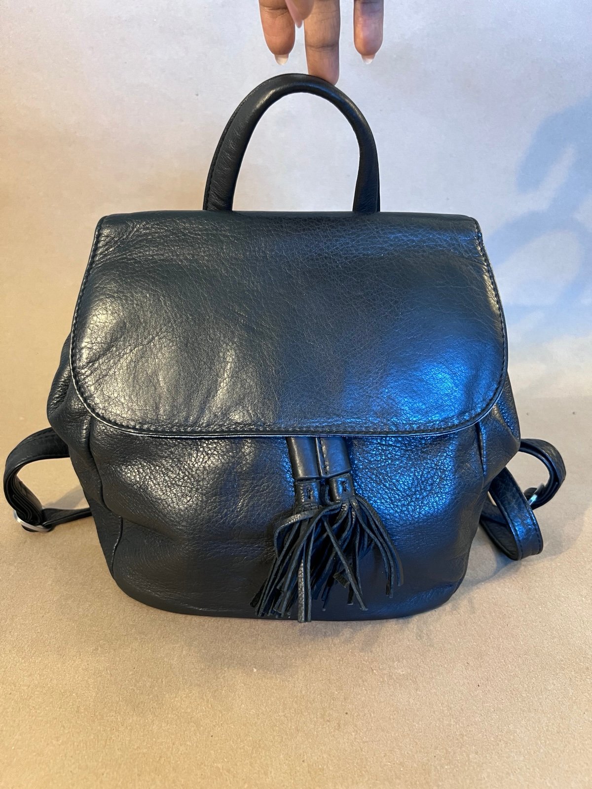Overland Black Genuine Leather Drawstring Flap Magnetic Close Backpack RFID