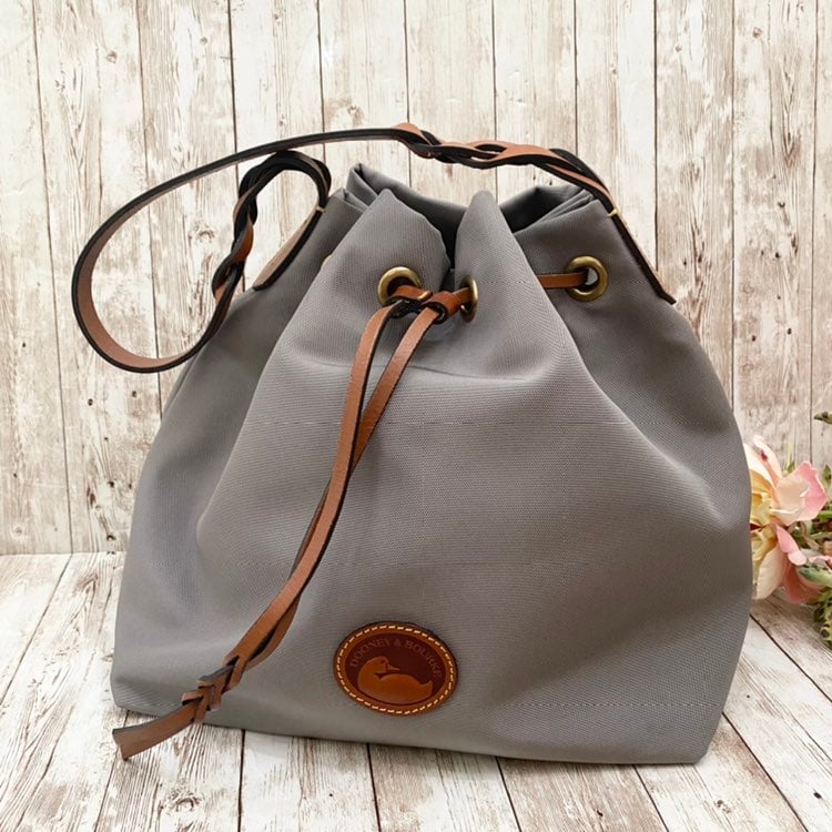 Authentic Dooney & Bourke Gray Nylon Drawstring Bucket Shoulder Bag. Pre-owned w