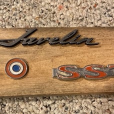Nice 1970 AMC Javelin badge mounted on wood.