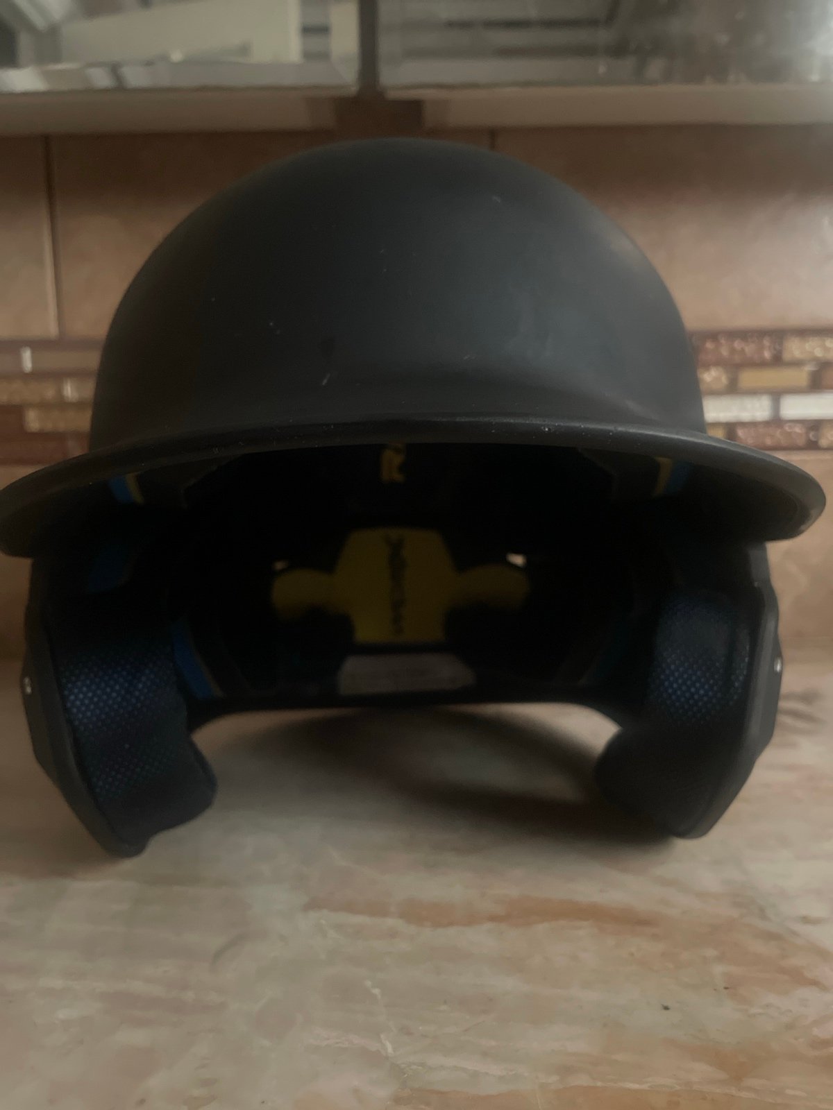 Black Rawlings baseball helmet
