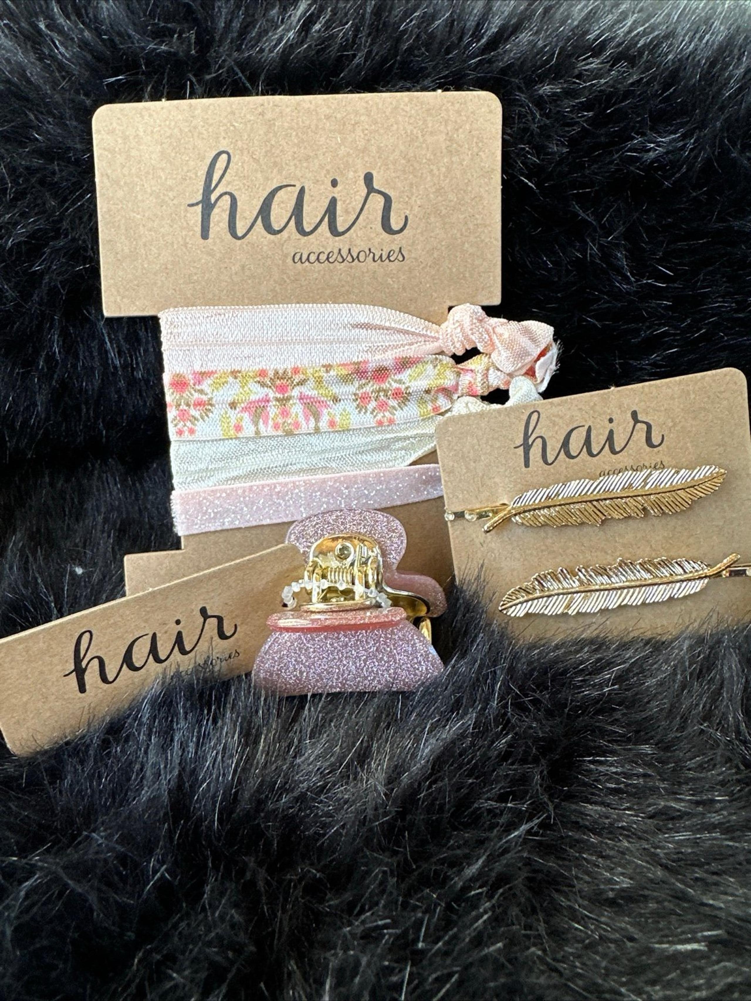 7 Piece Hair Accessories 2 Feather Pins 4 Hair Ties And A Glitter Pink Clip