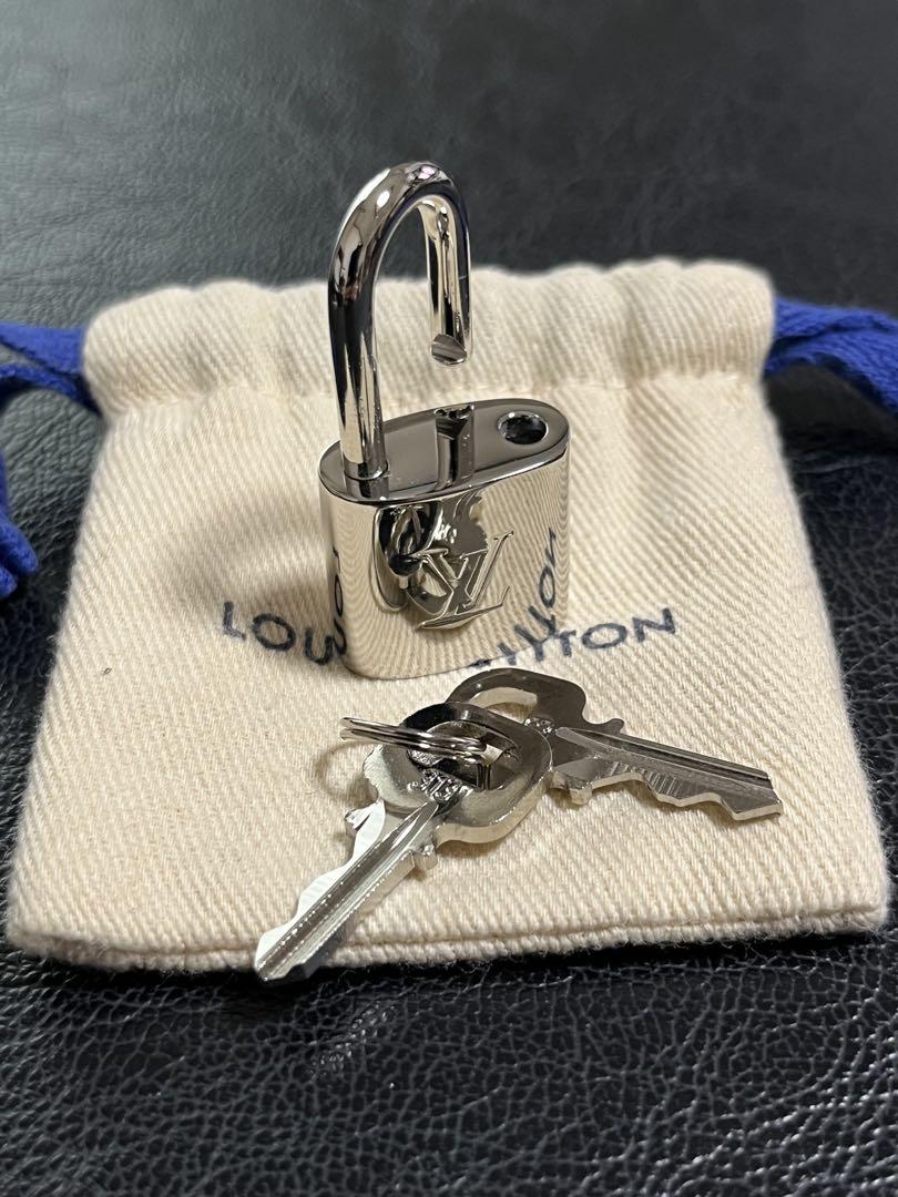 Excellent Condition Louis Vuitton Silver Padlock, Key, and Dust Bag - Unused, Stored Item