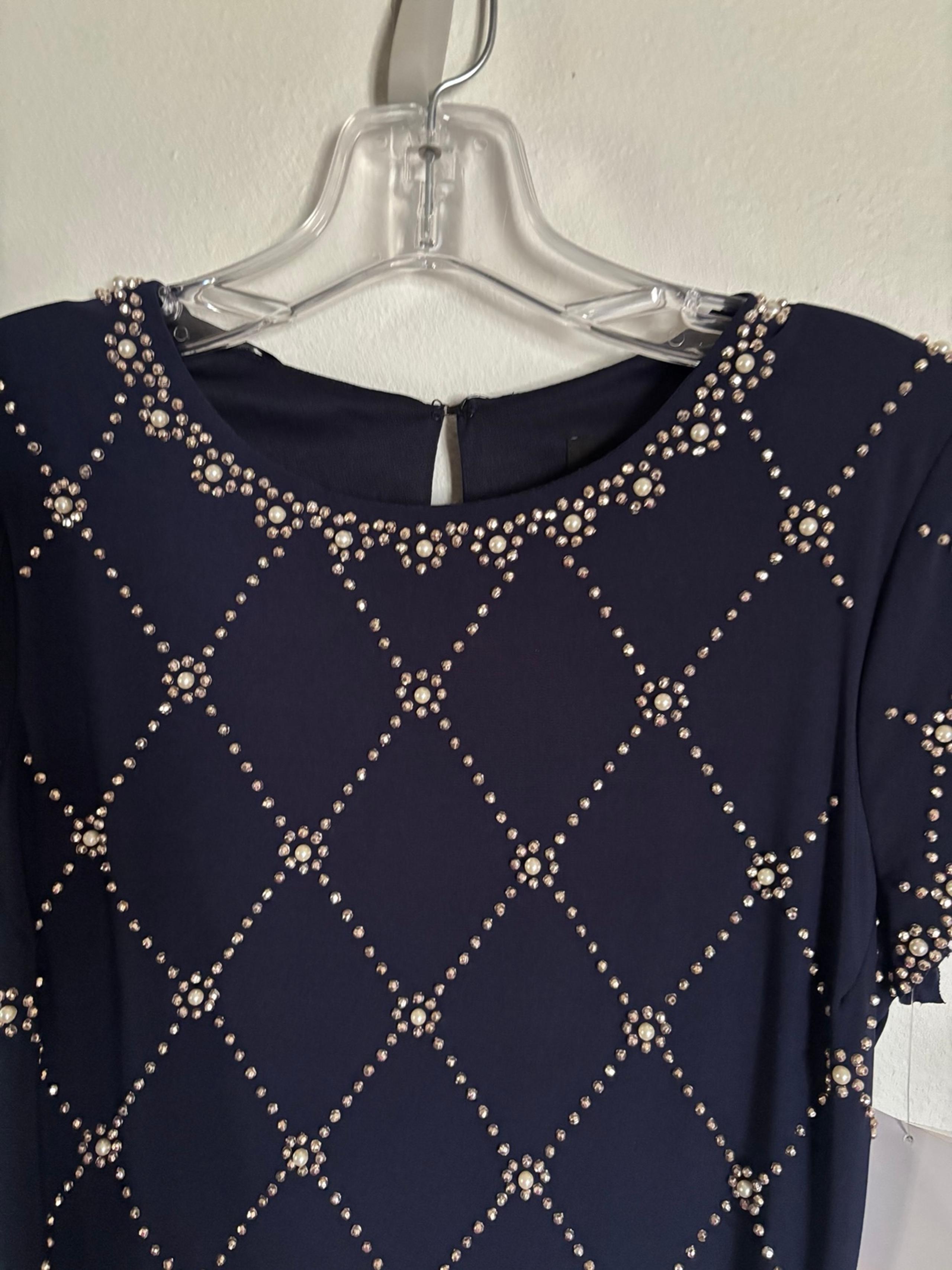 Betsy Adam designer dress . Never worn. Too small on me now. Retailed for $248.0