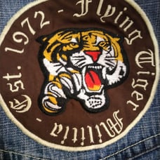 Vintage Men's Baggy Blue Jeans by Evolution in Design with an Embroidered Patch