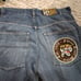 Vintage Men's Baggy Blue Jeans by Evolution in Design with an Embroidered Patch