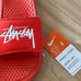 Benassi x Stüssy habanero red slides