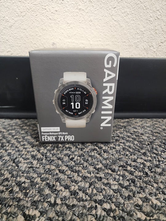 Garmin fenix 7X Pro Sapphire Solar Titanium Watch w/ Fog Gray Ember Orange Band
