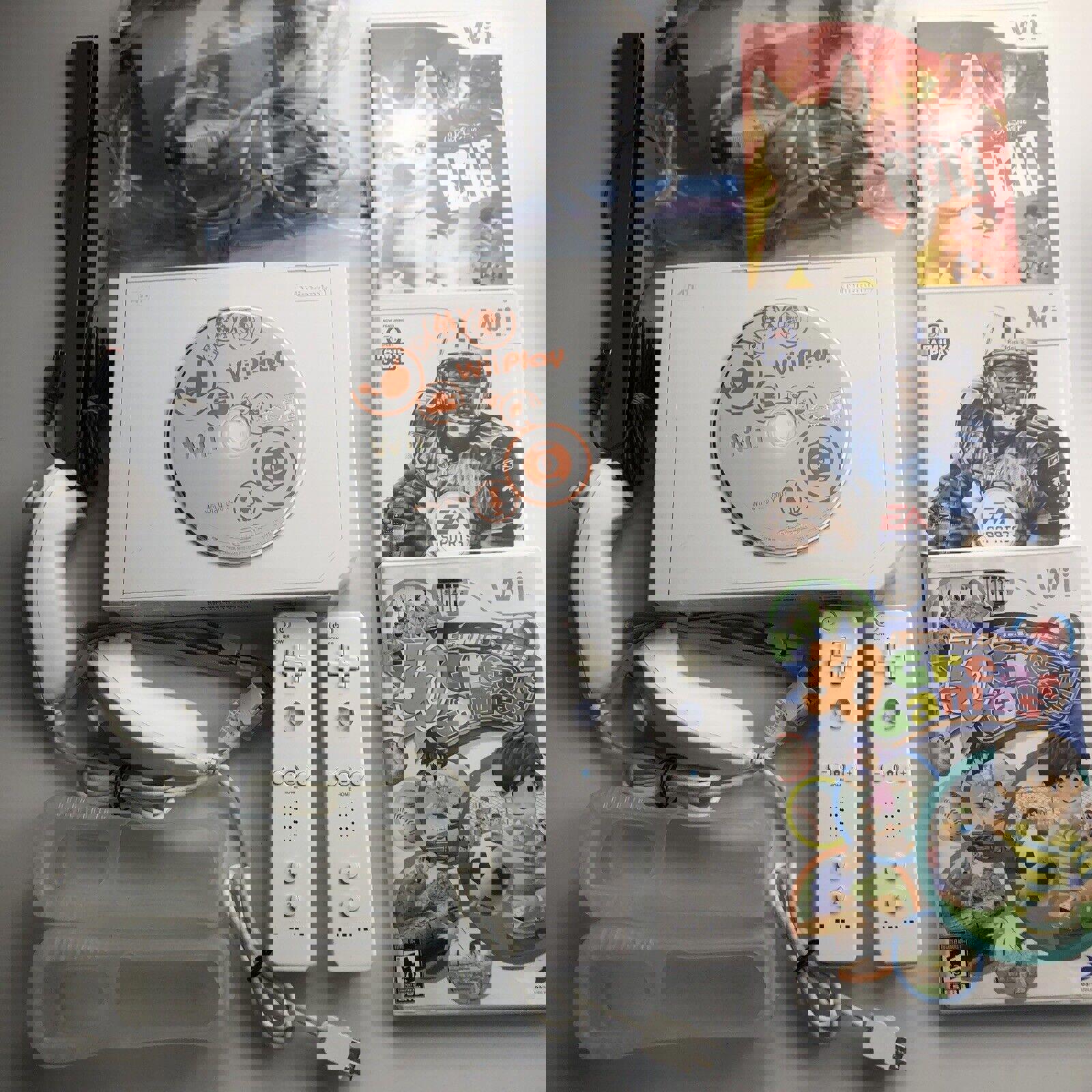 Wii Console Bundle with 4 games, 2 remotes, 2 nunchucks, sensor bar and cables