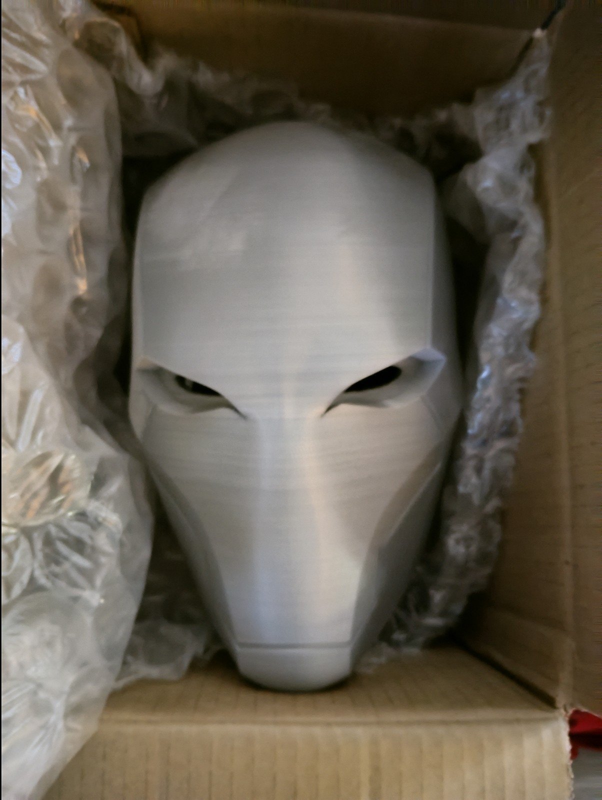 Unfinished red hood helmet