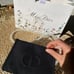 Dior makeup pouch bag with pearl chain