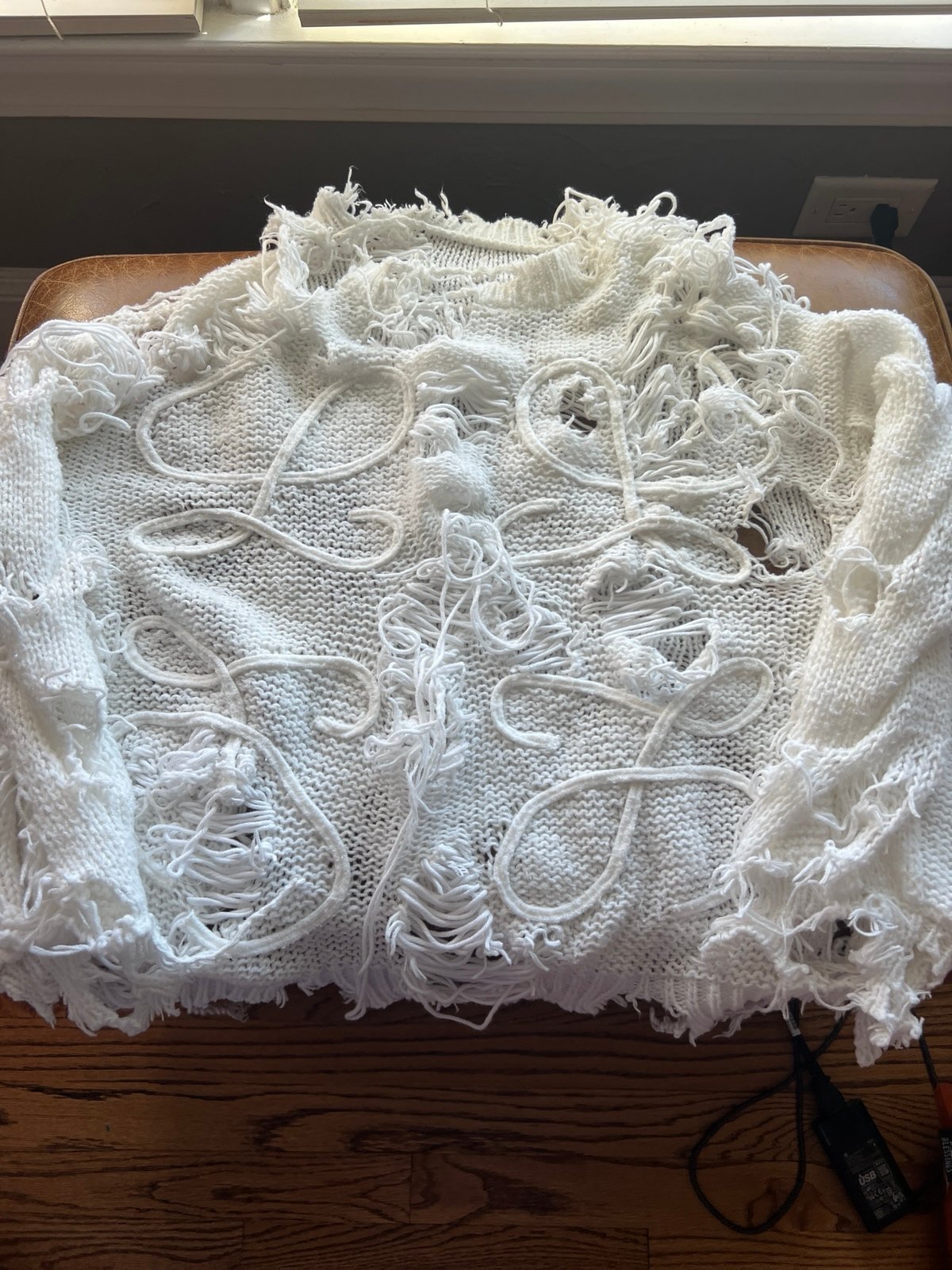 Distressed luxury sweater
