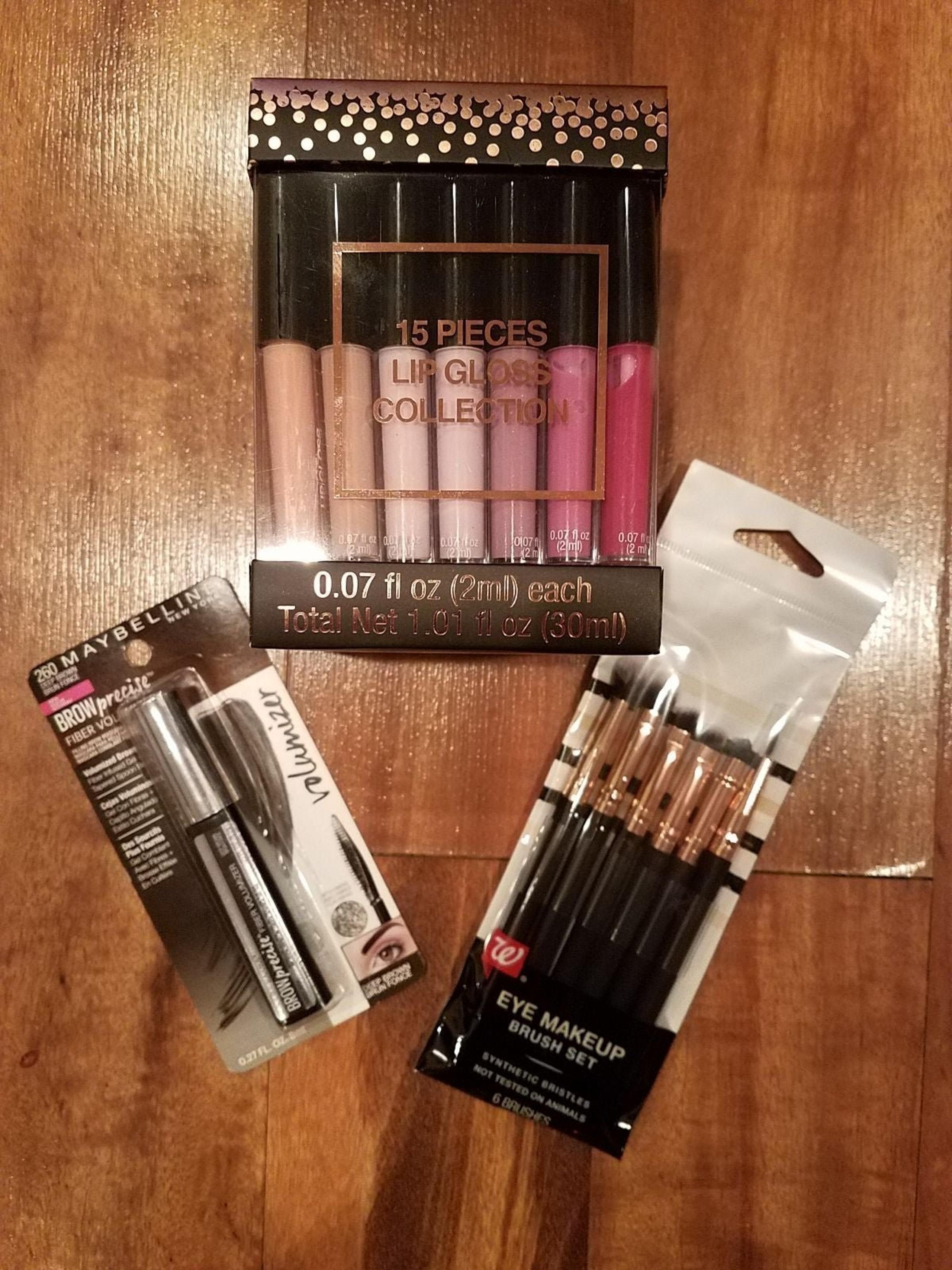 Brand new large lot of women's make up and lip gloss