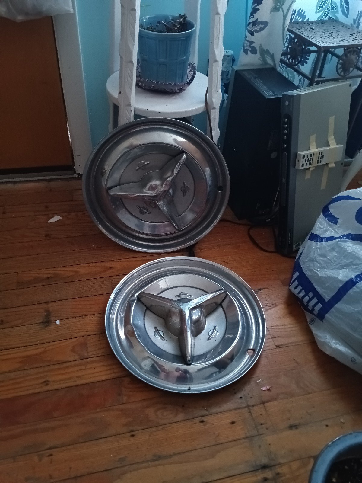 2 Oldsmobile spinner hubcaps