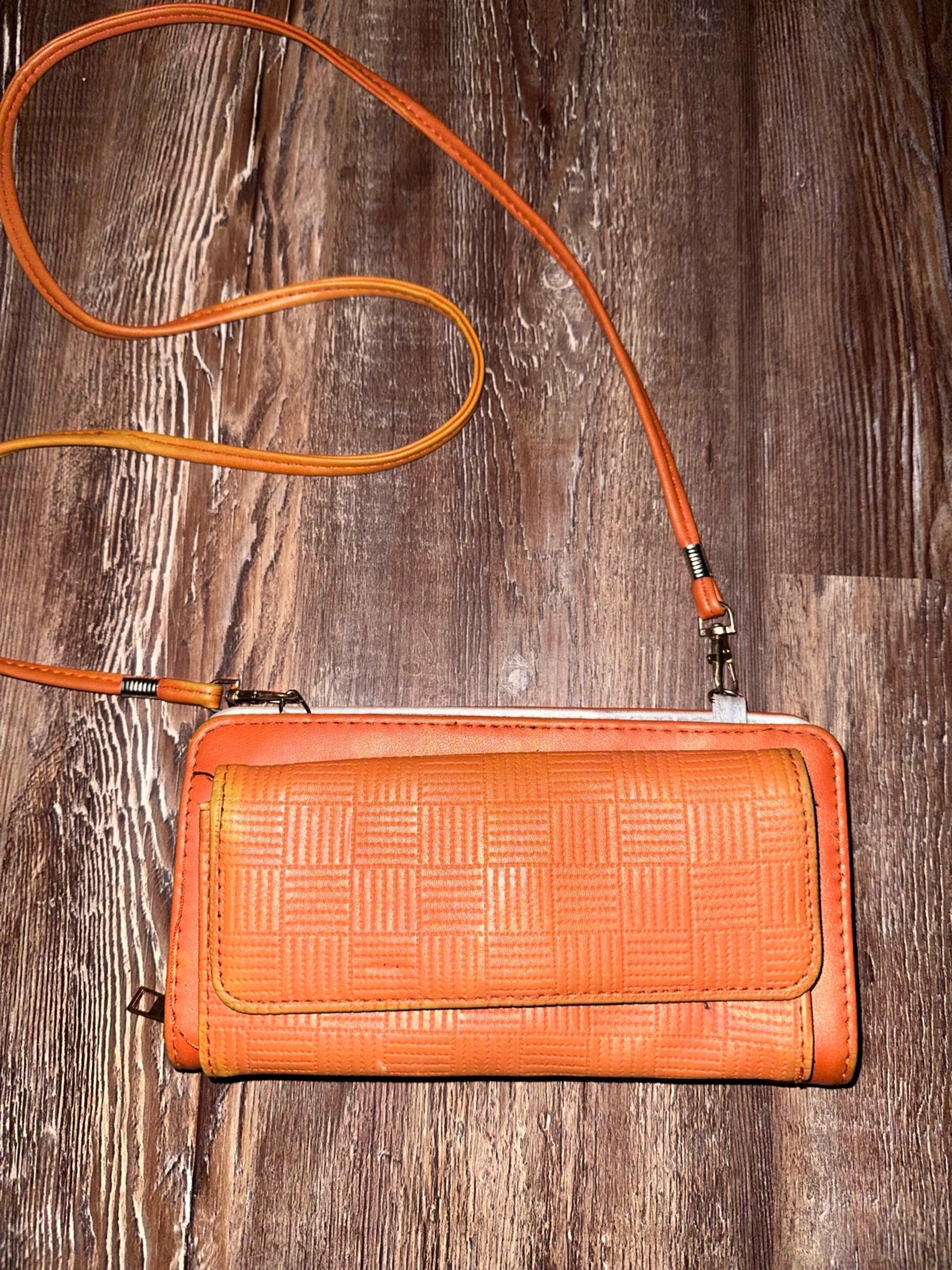 Double zip orange leather w/silver lining clutch