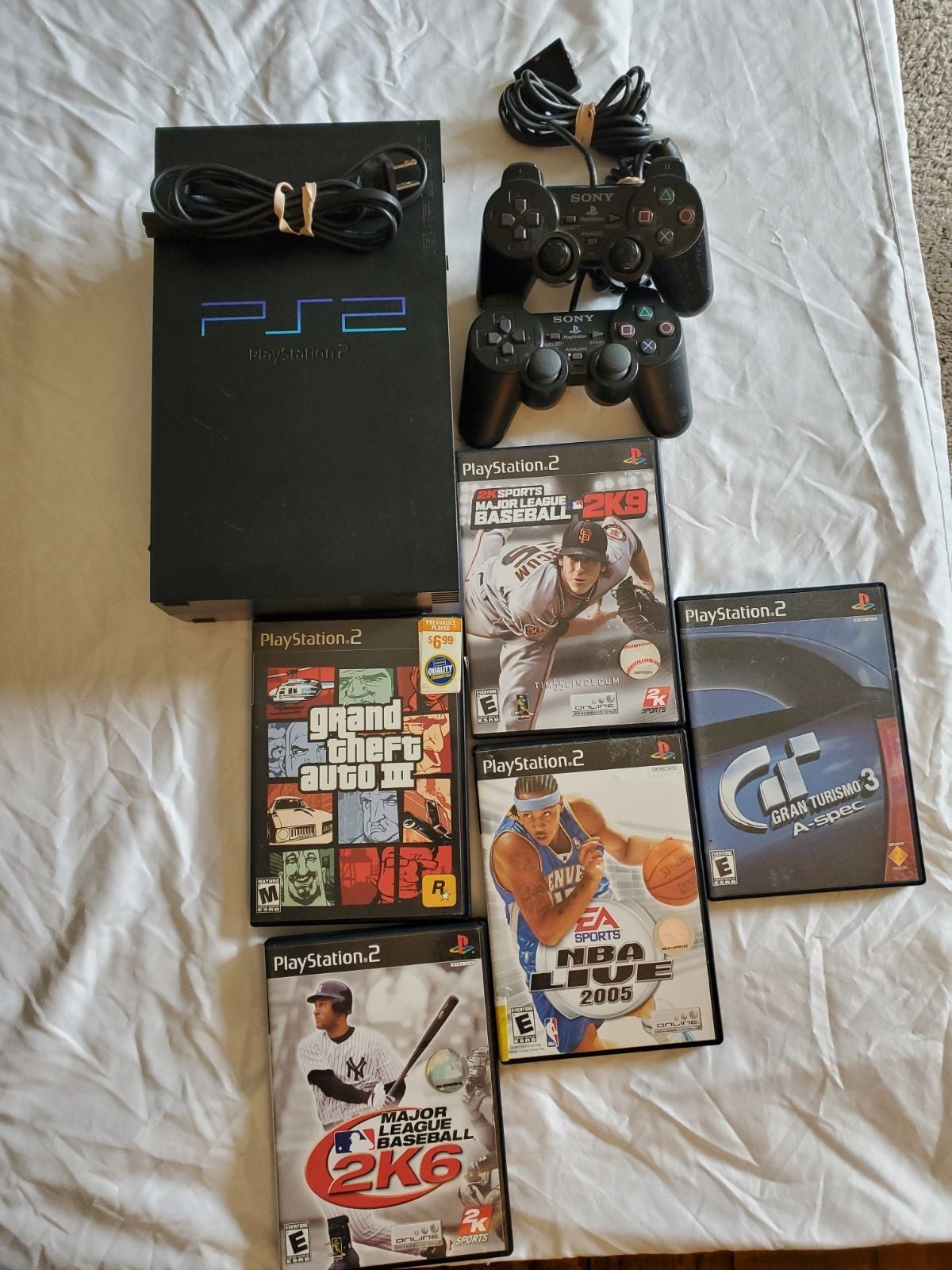Sony PlayStation 2, Black, with power Cord, 5 games, 2 Controllers.