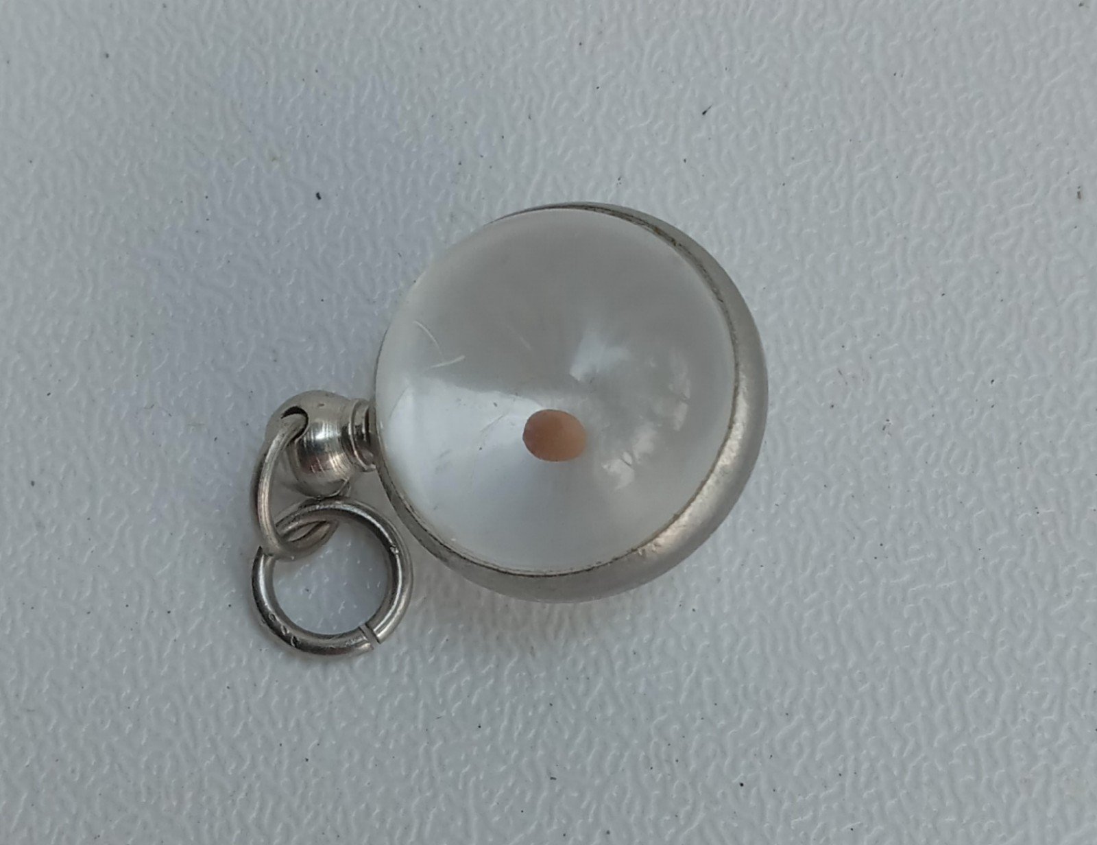 Vintage lucite mustard seed pendant
