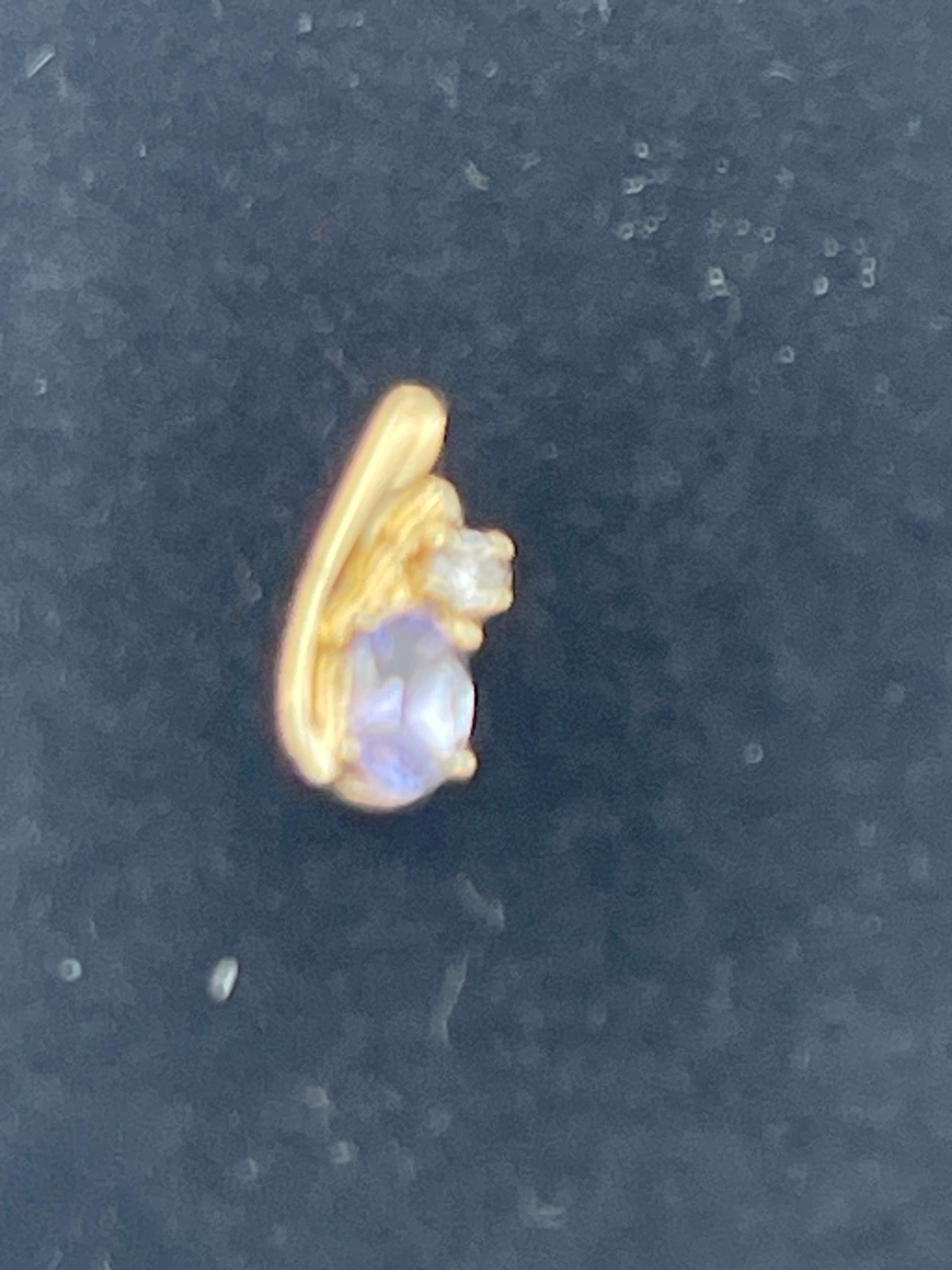 Vintage Tanzanite and diamond pendant 14 karat yellow gold