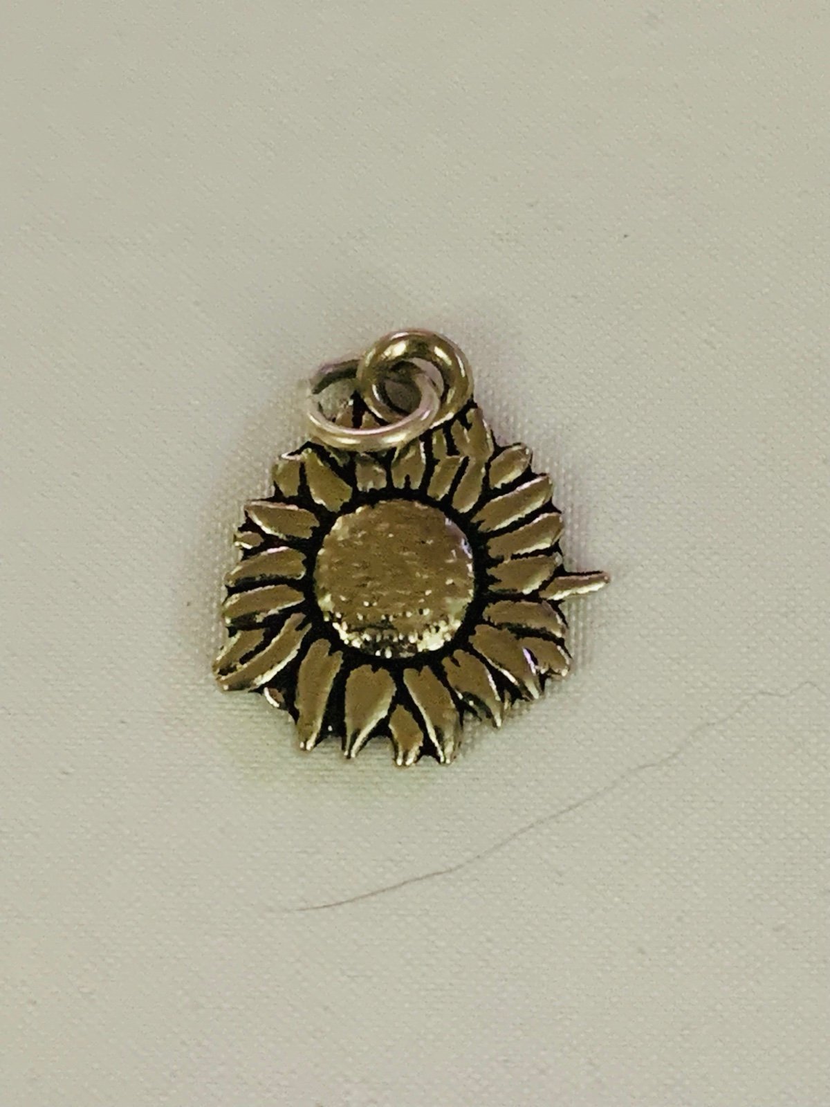 Silver sunflower charm