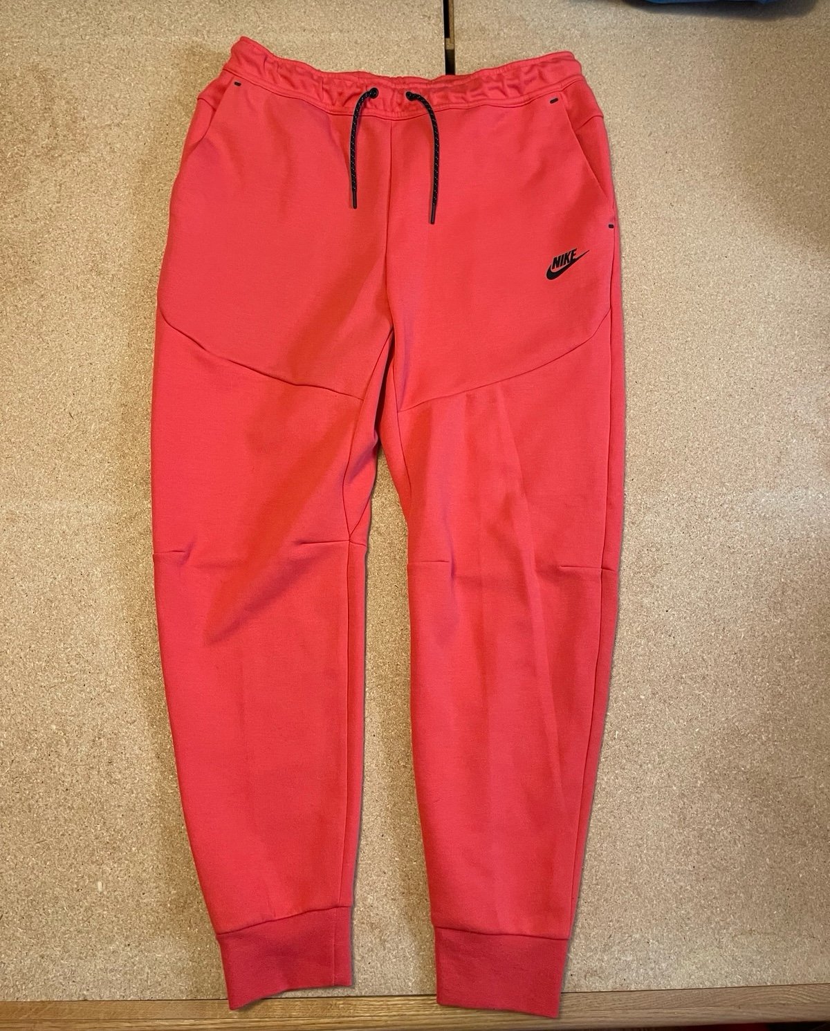 Brand new red Nike tech pants